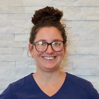 Headshot of their office manage, Meghan